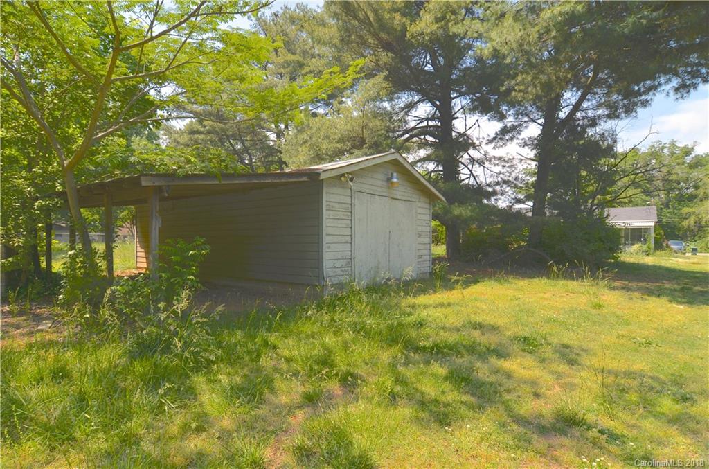 6207 Tuckaseegee Road Charlotte, NC 28208 - Photo 15 of 20 a backyard of a house with lots of green space