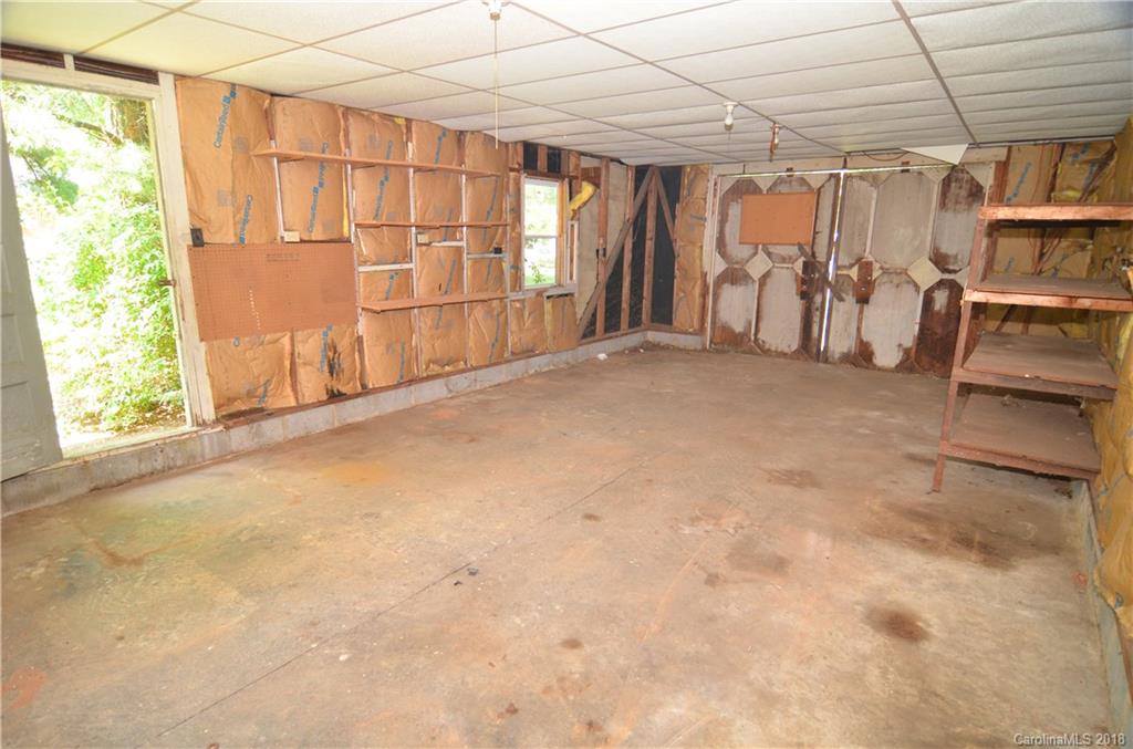 6207 Tuckaseegee Road Charlotte, NC 28208 - Photo 18 of 20 a view of a room with furniture and a window