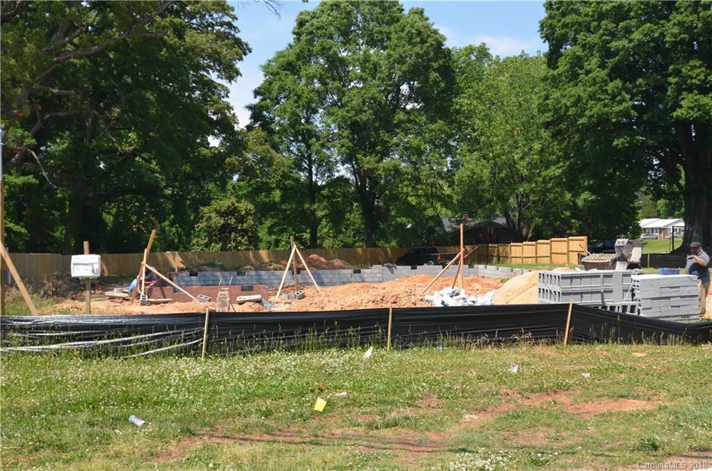 6207 Tuckaseegee Road Charlotte, NC 28208 - Photo 20 of 20 a view of house with swimming pool and trees