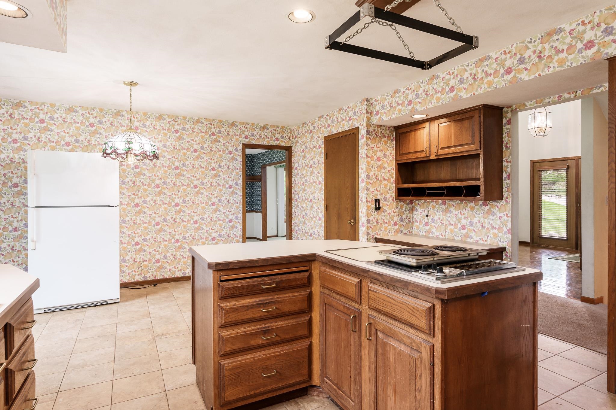 10245 Tybow Trail Roscoe, IL 61073 - Photo 16 of 63 a kitchen with stainless steel appliances a refrigerator and a stove top oven