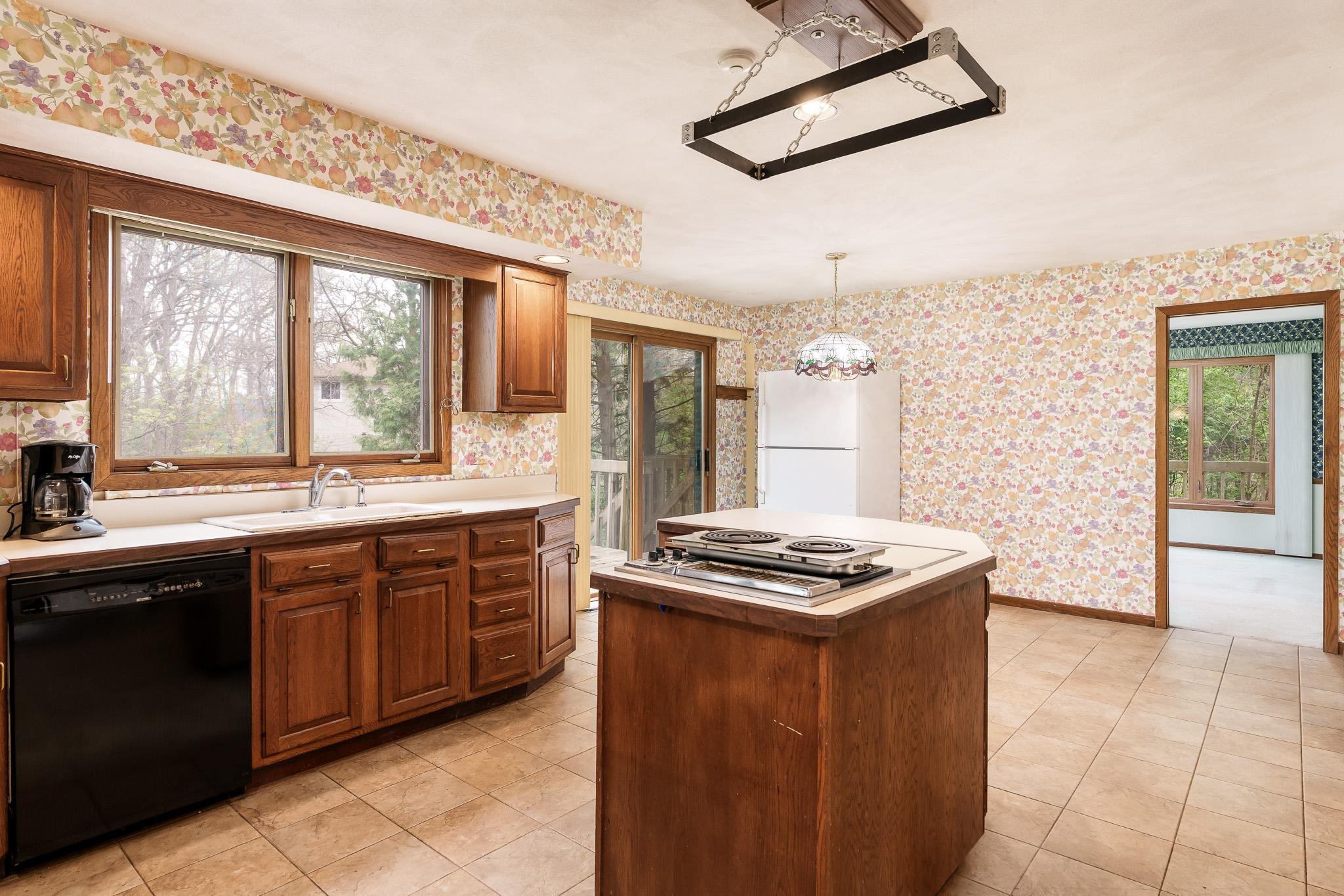 10245 Tybow Trail Roscoe, IL 61073 - Photo 17 of 63 a kitchen with stainless steel appliances granite countertop a stove a sink dishwasher and a refrigerator