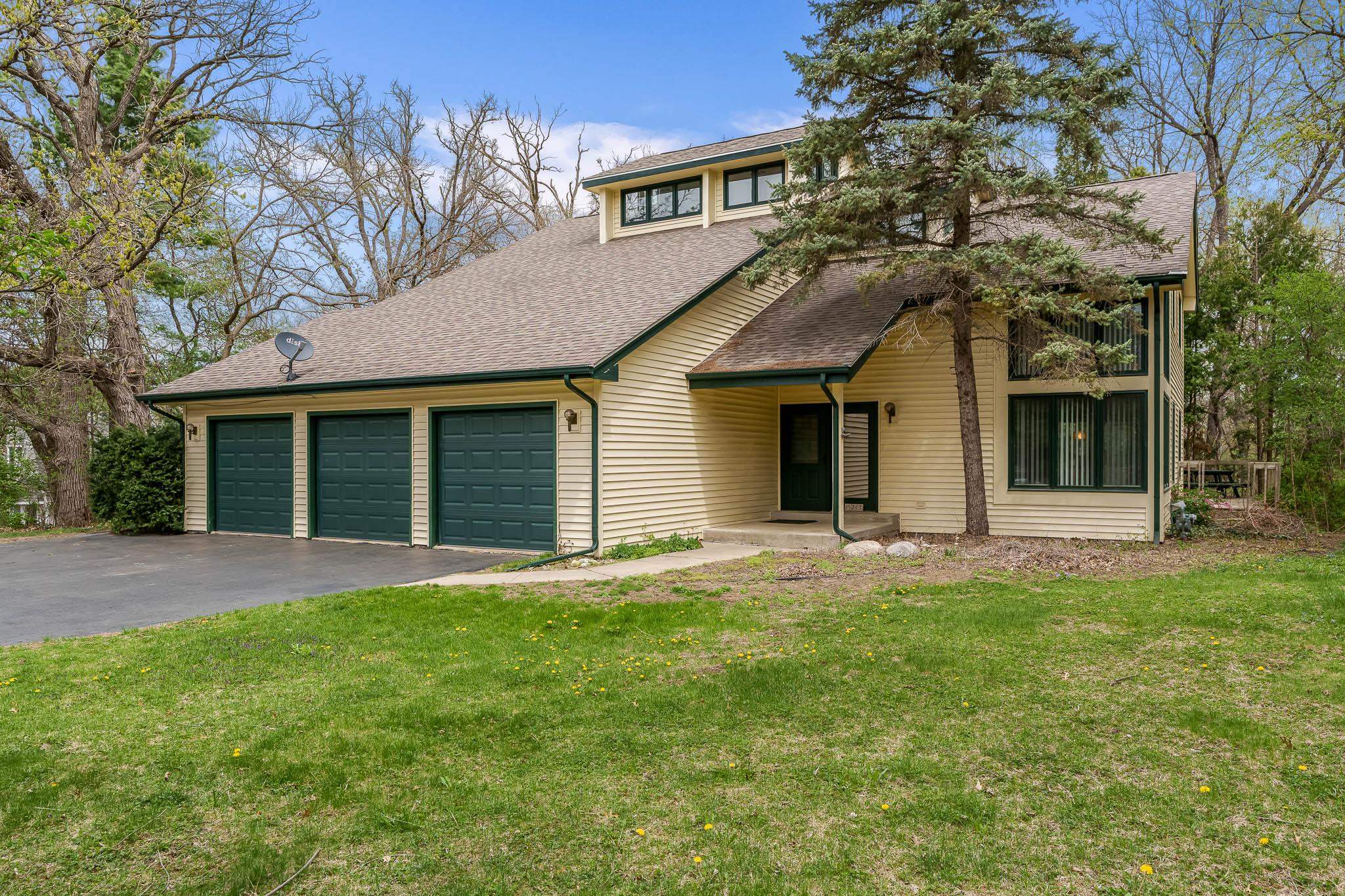 10245 Tybow Trail Roscoe, IL 61073 - Photo 2 of 63 front view of a house with a yard