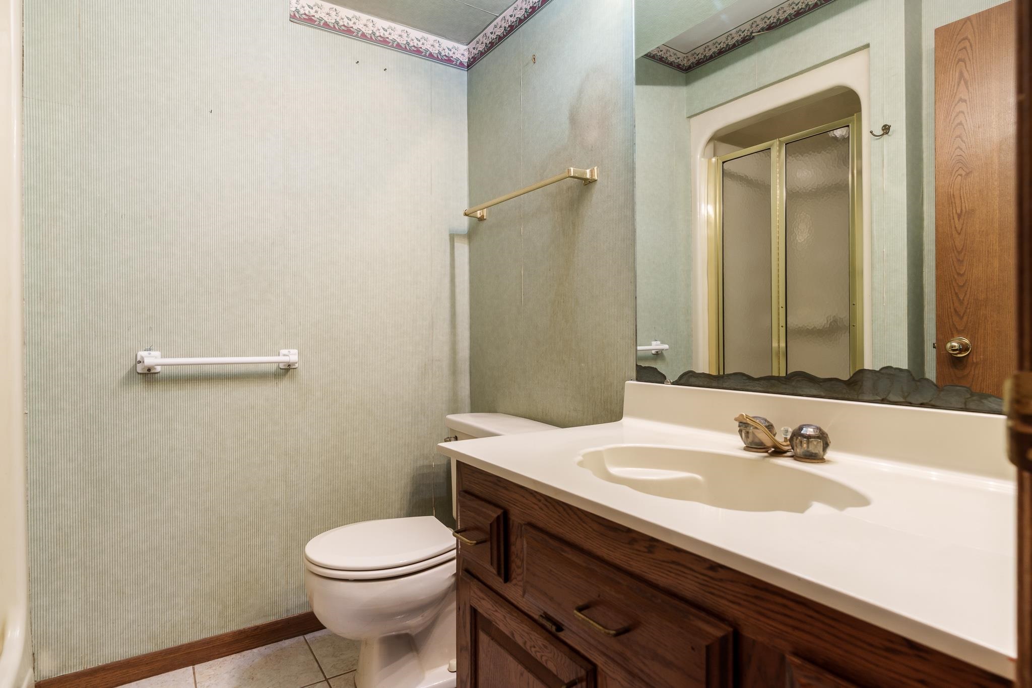 10245 Tybow Trail Roscoe, IL 61073 - Photo 27 of 63 a bathroom with a sink and a toilet