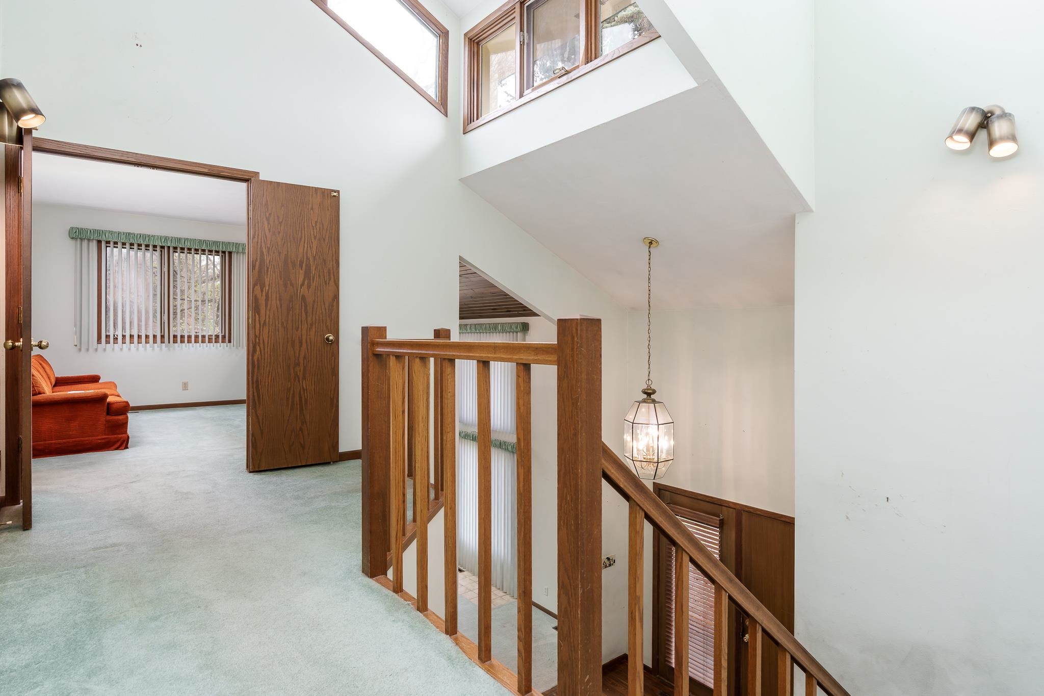 10245 Tybow Trail Roscoe, IL 61073 - Photo 28 of 63 a view of a hallway to a livingroom with furniture