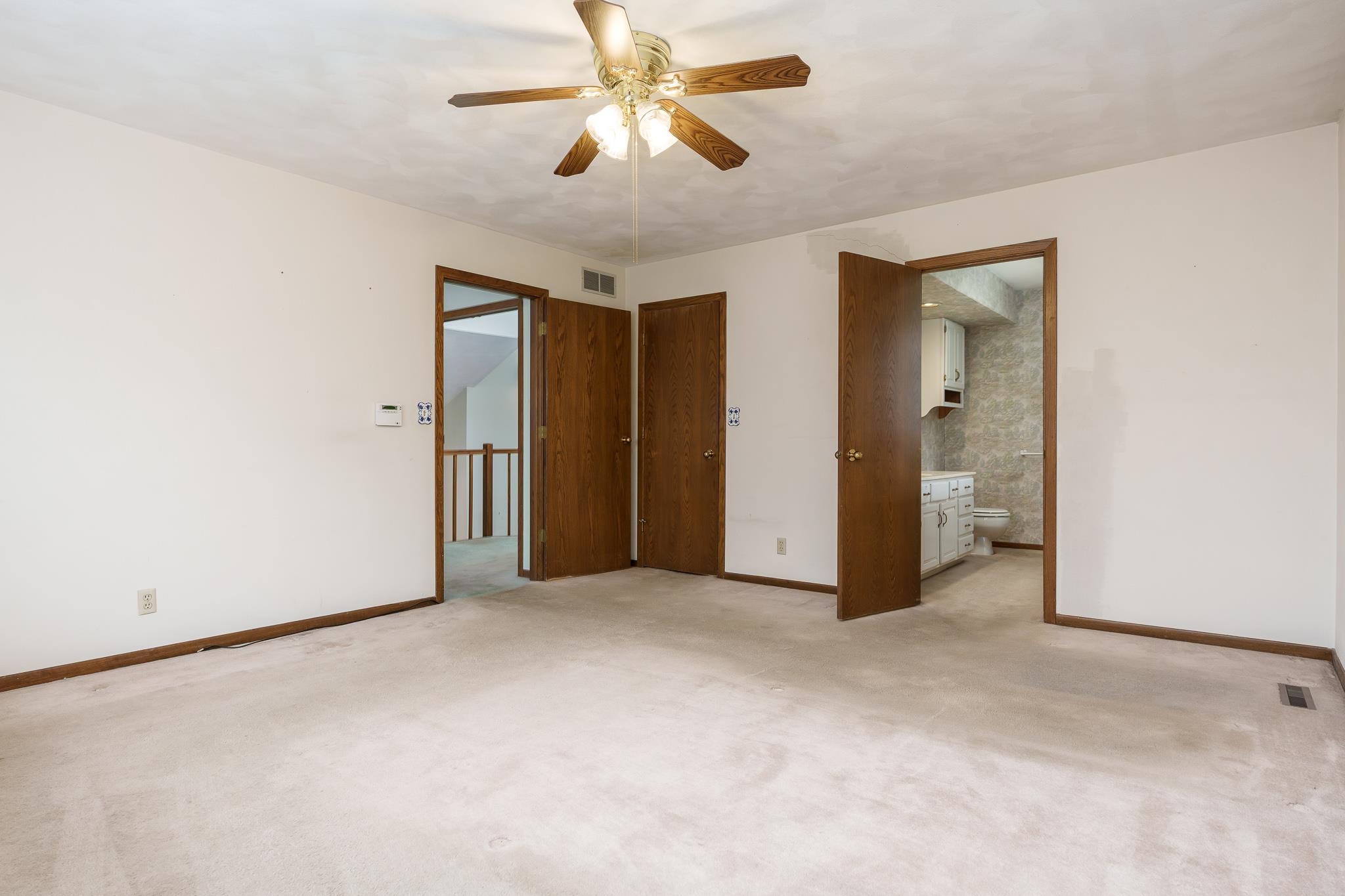 10245 Tybow Trail Roscoe, IL 61073 - Photo 32 of 63 an empty room with closet and a chandelier fan