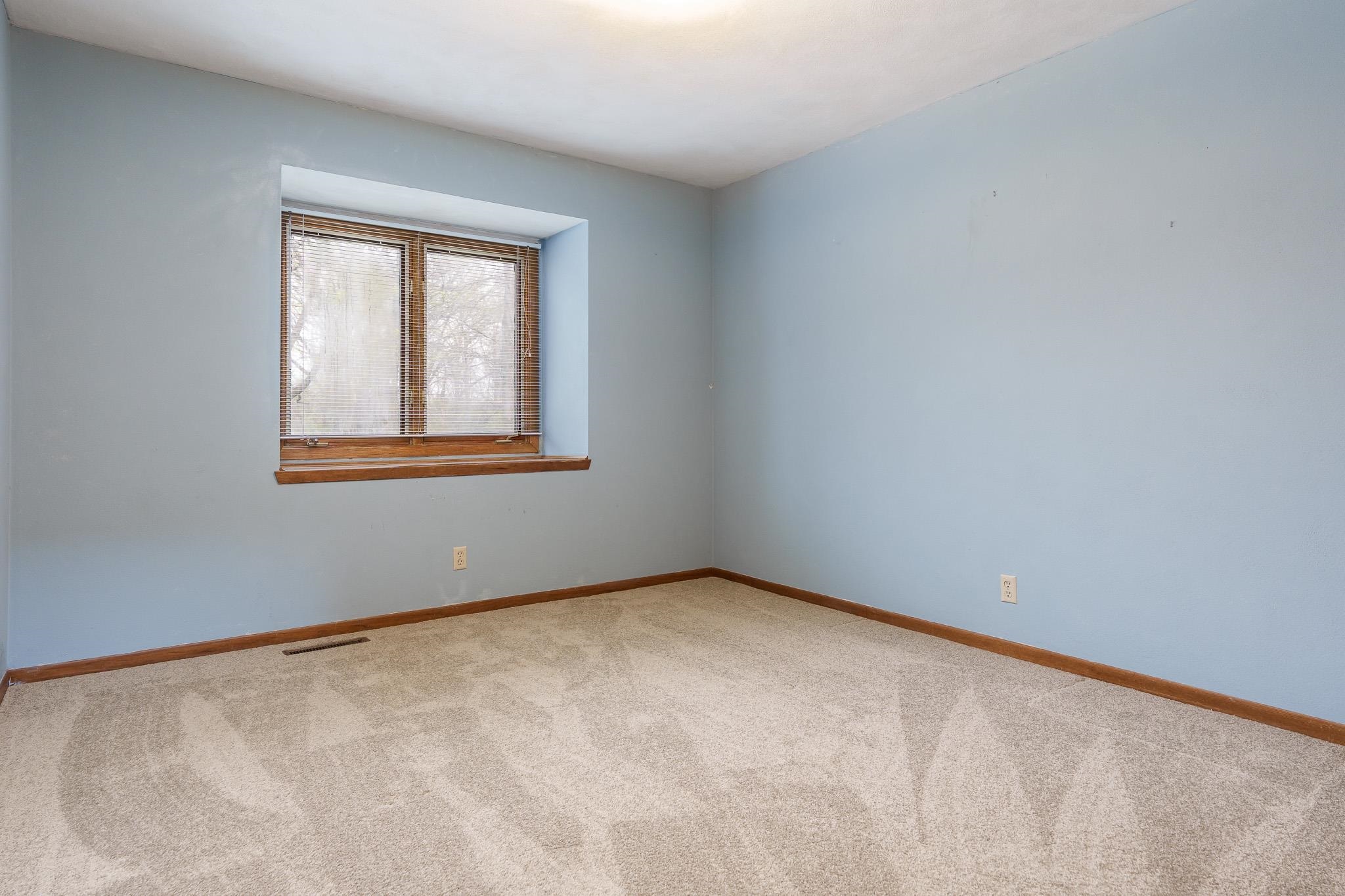 10245 Tybow Trail Roscoe, IL 61073 - Photo 40 of 63 a view of an empty room with a window
