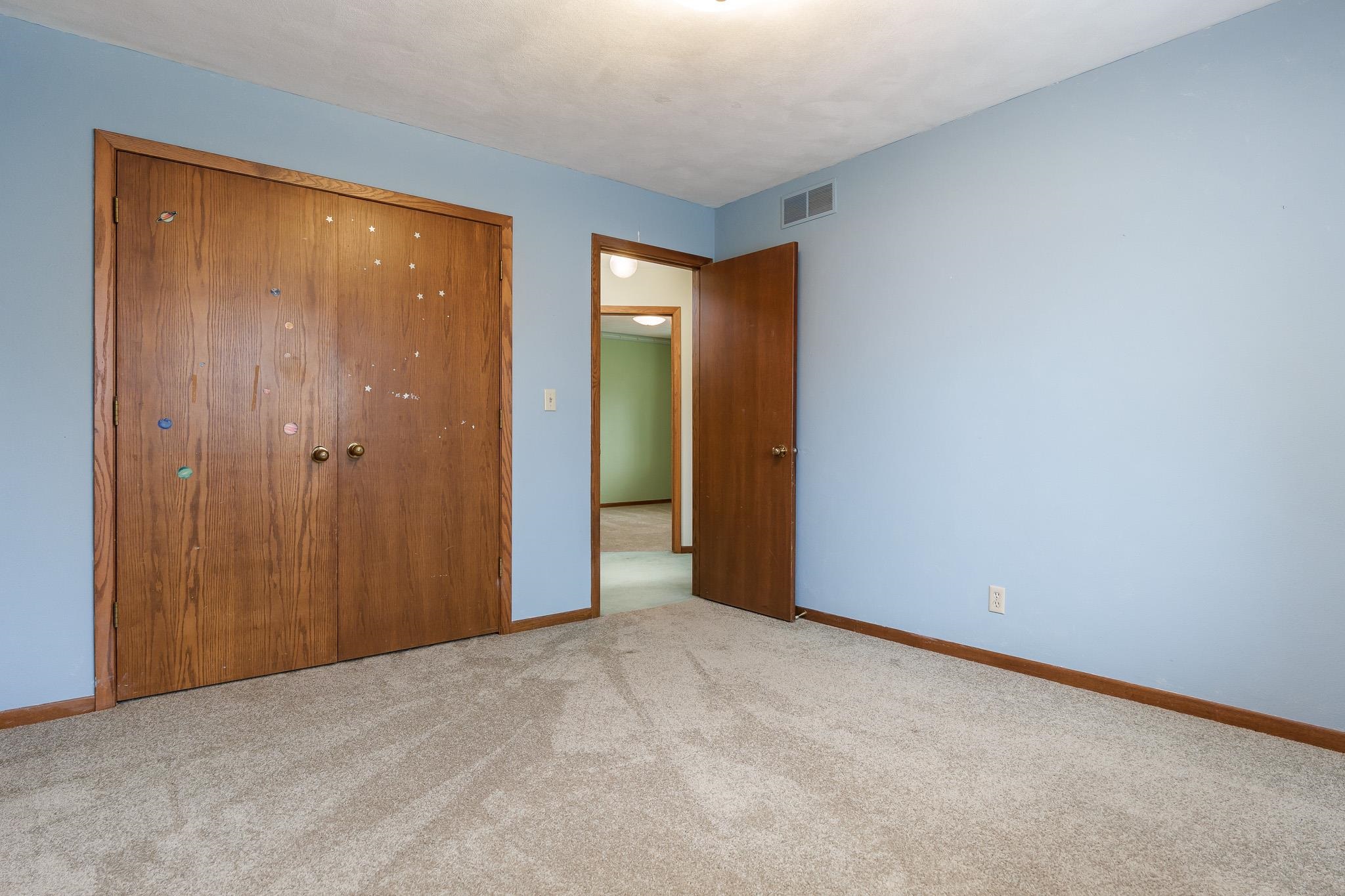 10245 Tybow Trail Roscoe, IL 61073 - Photo 41 of 63 a view of an empty room with closet and a window