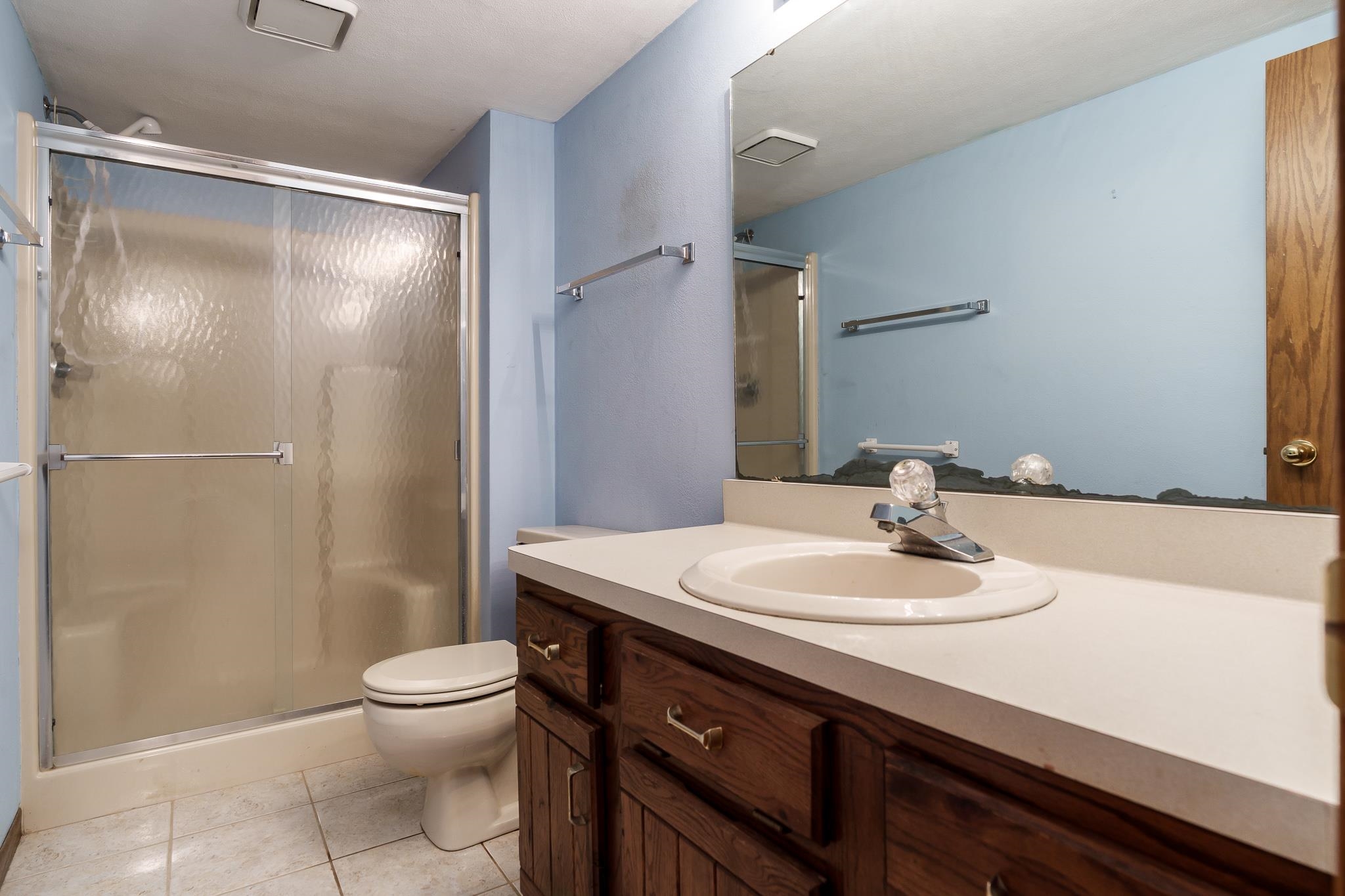 10245 Tybow Trail Roscoe, IL 61073 - Photo 47 of 63 a bathroom with a sink a toilet and shower