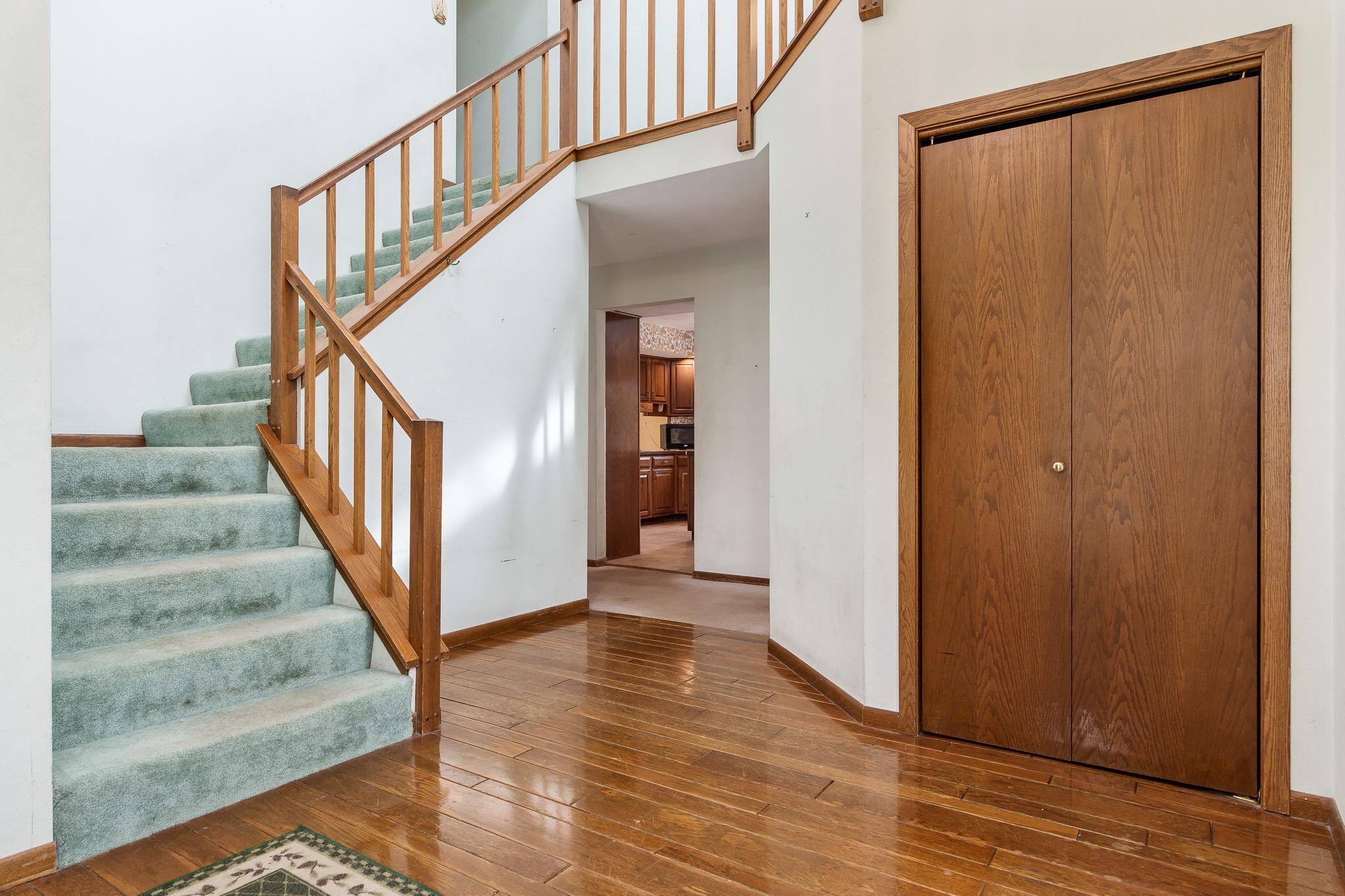 10245 Tybow Trail Roscoe, IL 61073 - Photo 5 of 63 a view of an entryway with wooden floor and door