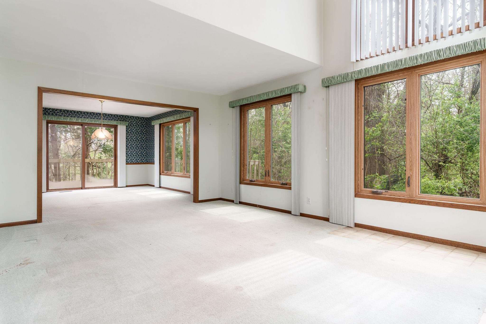 10245 Tybow Trail Roscoe, IL 61073 - Photo 6 of 63 an empty room with windows