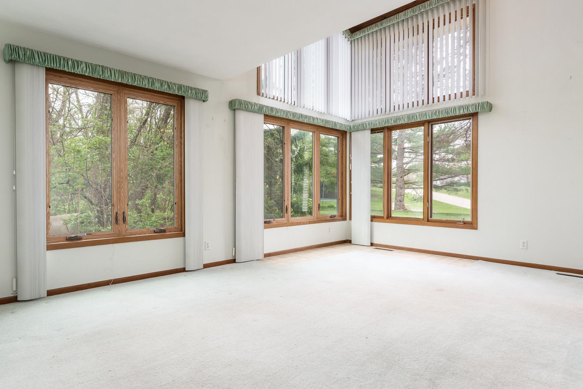 10245 Tybow Trail Roscoe, IL 61073 - Photo 9 of 63 an empty room with windows and view of an empty room
