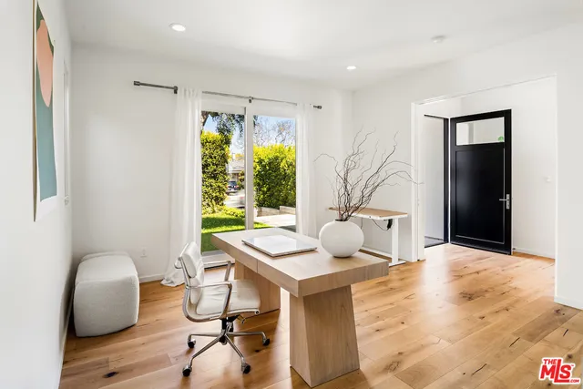 a workspace with furniture and window