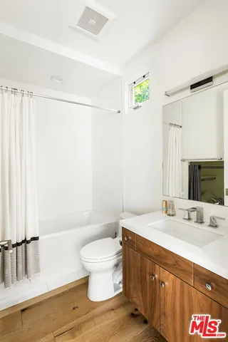 a bathroom with a sink a toilet and a bathtub