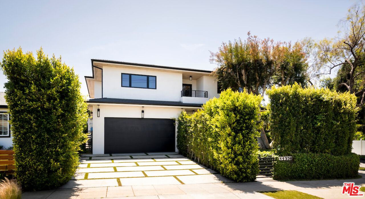 11328 Charnock Road Los Angeles, CA 90066 - Photo 2 of 34 a front view of a house with a yard