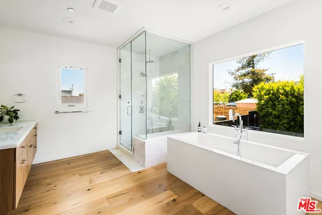 a bathroom with a sink and a large mirror