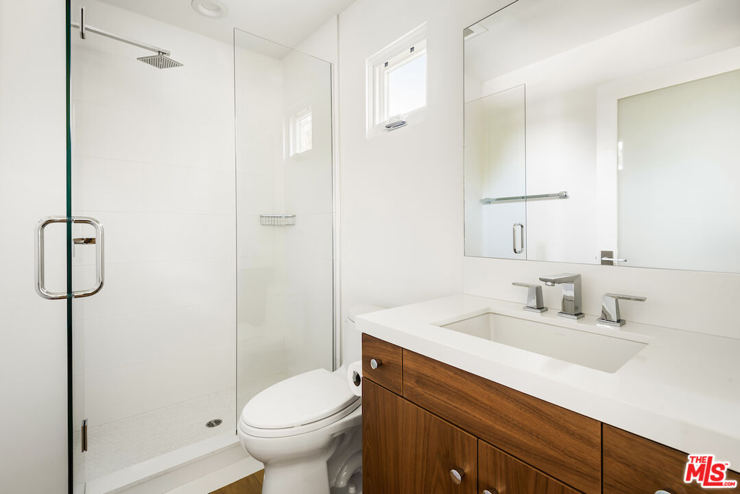 11328 Charnock Road Los Angeles, CA 90066 - Photo 27 of 34 a bathroom with a sink toilet and shower