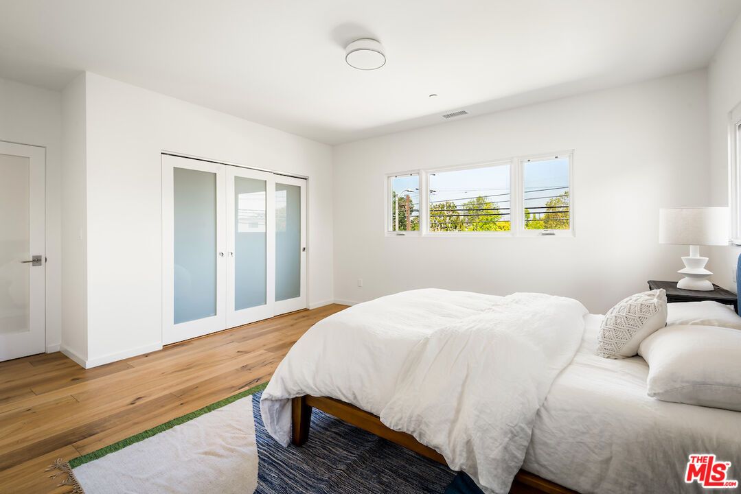 11328 Charnock Road Los Angeles, CA 90066 - Photo 30 of 34 a bedroom with a bed and a window