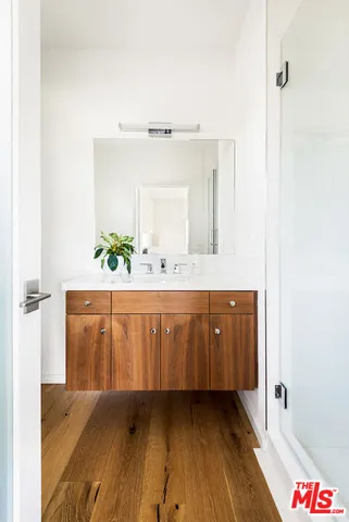 a bathroom with a mirror and a sink