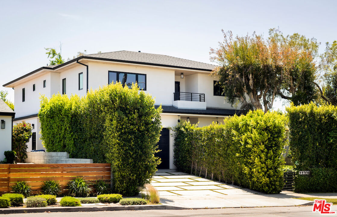 11328 Charnock Road Los Angeles, CA 90066 - Photo 6 of 34 a front view of a house with garden