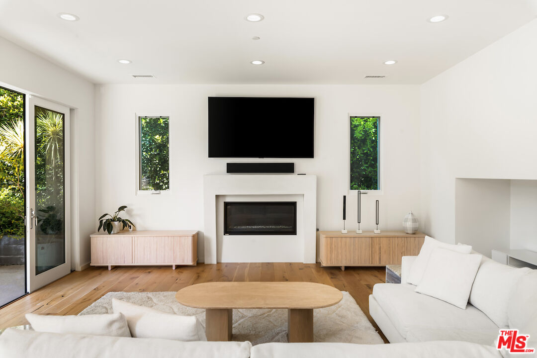 11328 Charnock Road Los Angeles, CA 90066 - Photo 9 of 34 a living room with furniture and a flat screen tv