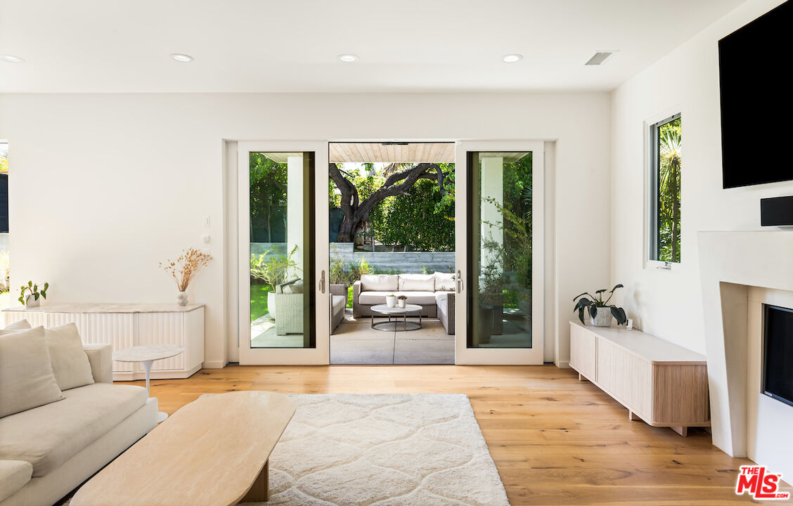 11328 Charnock Road Los Angeles, CA 90066 - Photo 10 of 34 a living room with furniture and a flat screen tv