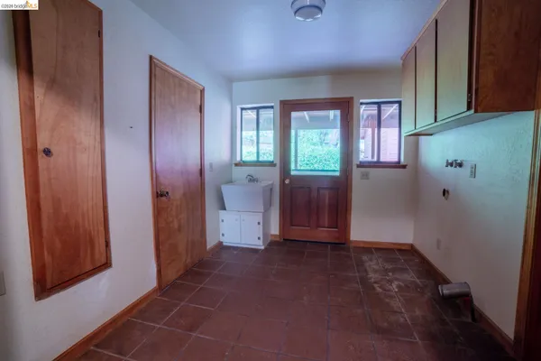 a view of entryway with window and hallway