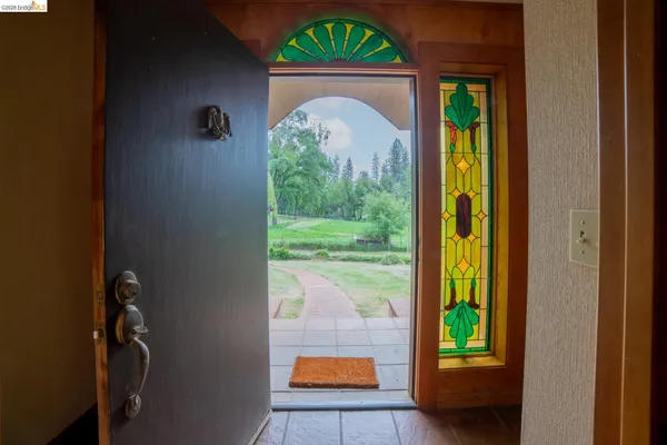 a view of hall way with furniture