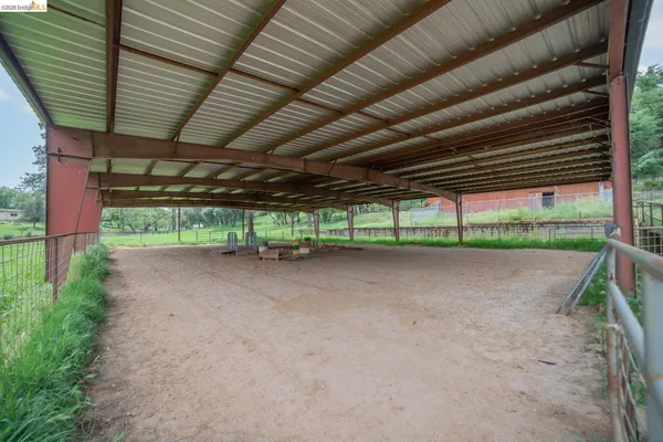 a view of a small house with a yard