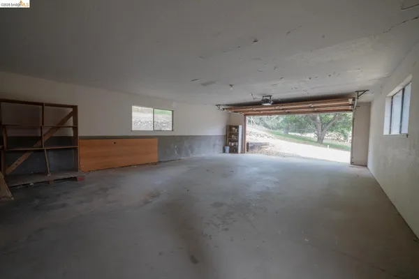 a view of a livingroom with furniture and windows
