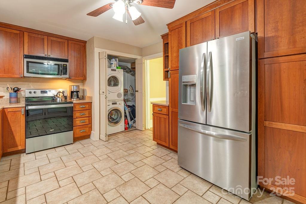 54 Spooks Branch Road Asheville, NC 28804 - Photo 12 of 41 a kitchen with stainless steel appliances granite countertop a refrigerator a stove and a sink