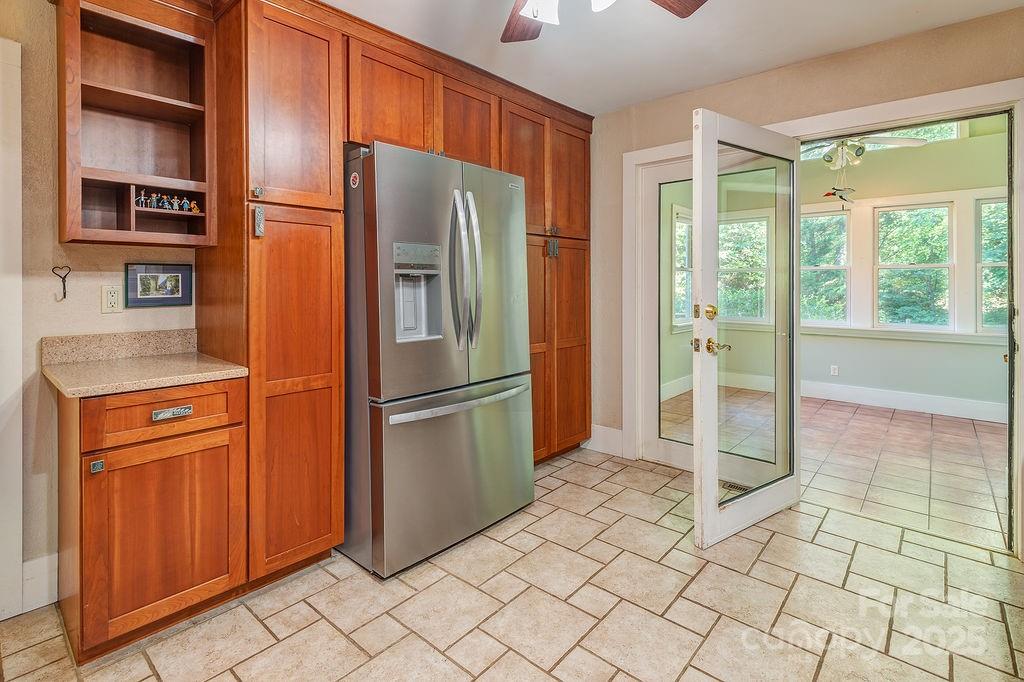 54 Spooks Branch Road Asheville, NC 28804 - Photo 13 of 41 a metallic refrigerator freezer sitting in a kitchen