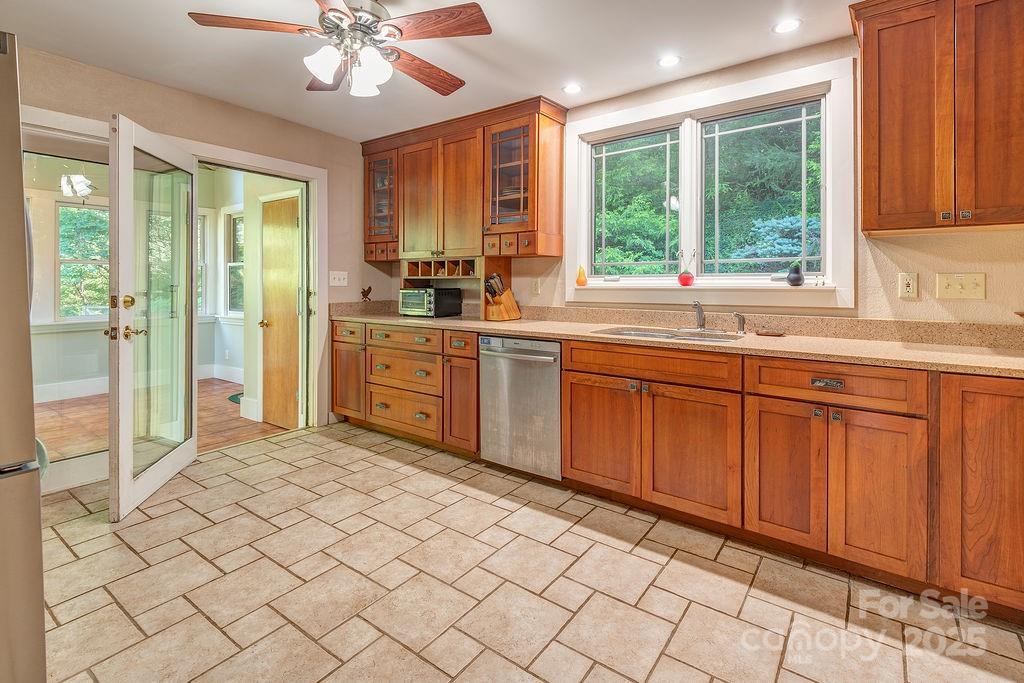 54 Spooks Branch Road Asheville, NC 28804 - Photo 14 of 41 a kitchen with a sink window and cabinets