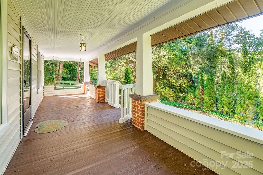 54 Spooks Branch Road Asheville, NC 28804 - Photo 2 of 41 a view of a room with wooden floor and furniture