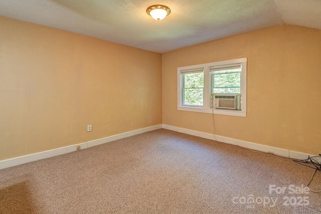 54 Spooks Branch Road Asheville, NC 28804 - Photo 22 of 41 an empty room with a window
