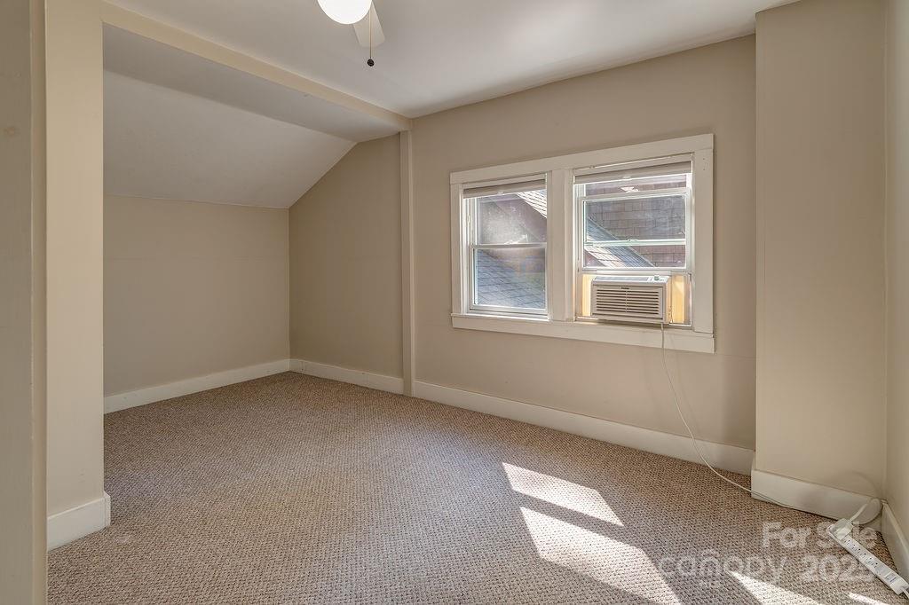 54 Spooks Branch Road Asheville, NC 28804 - Photo 26 of 41 a view of an empty room with a window