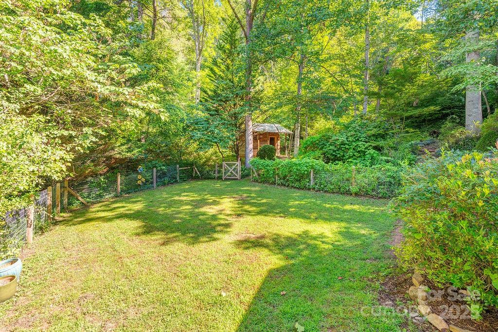 54 Spooks Branch Road Asheville, NC 28804 - Photo 38 of 41 a view of backyard of house with green space