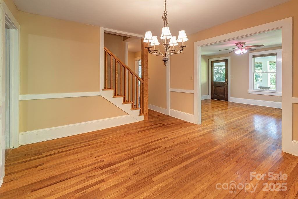 54 Spooks Branch Road Asheville, NC 28804 - Photo 8 of 41 a view of a livingroom with wooden floor closet and windows
