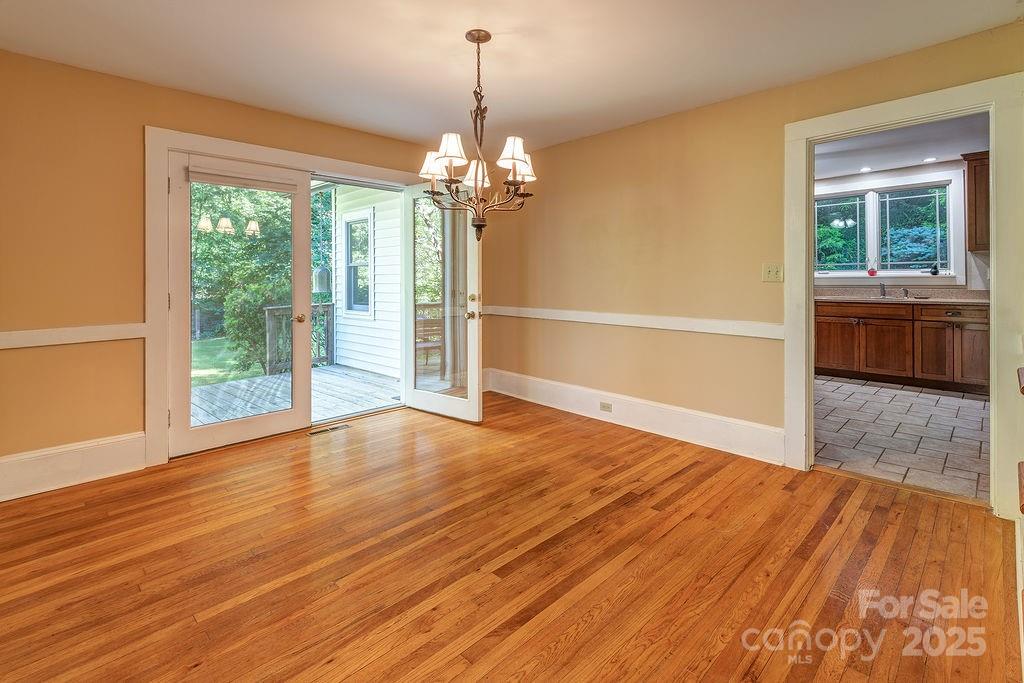 54 Spooks Branch Road Asheville, NC 28804 - Photo 9 of 41 a view of livingroom with hardwood floor and ceiling fan