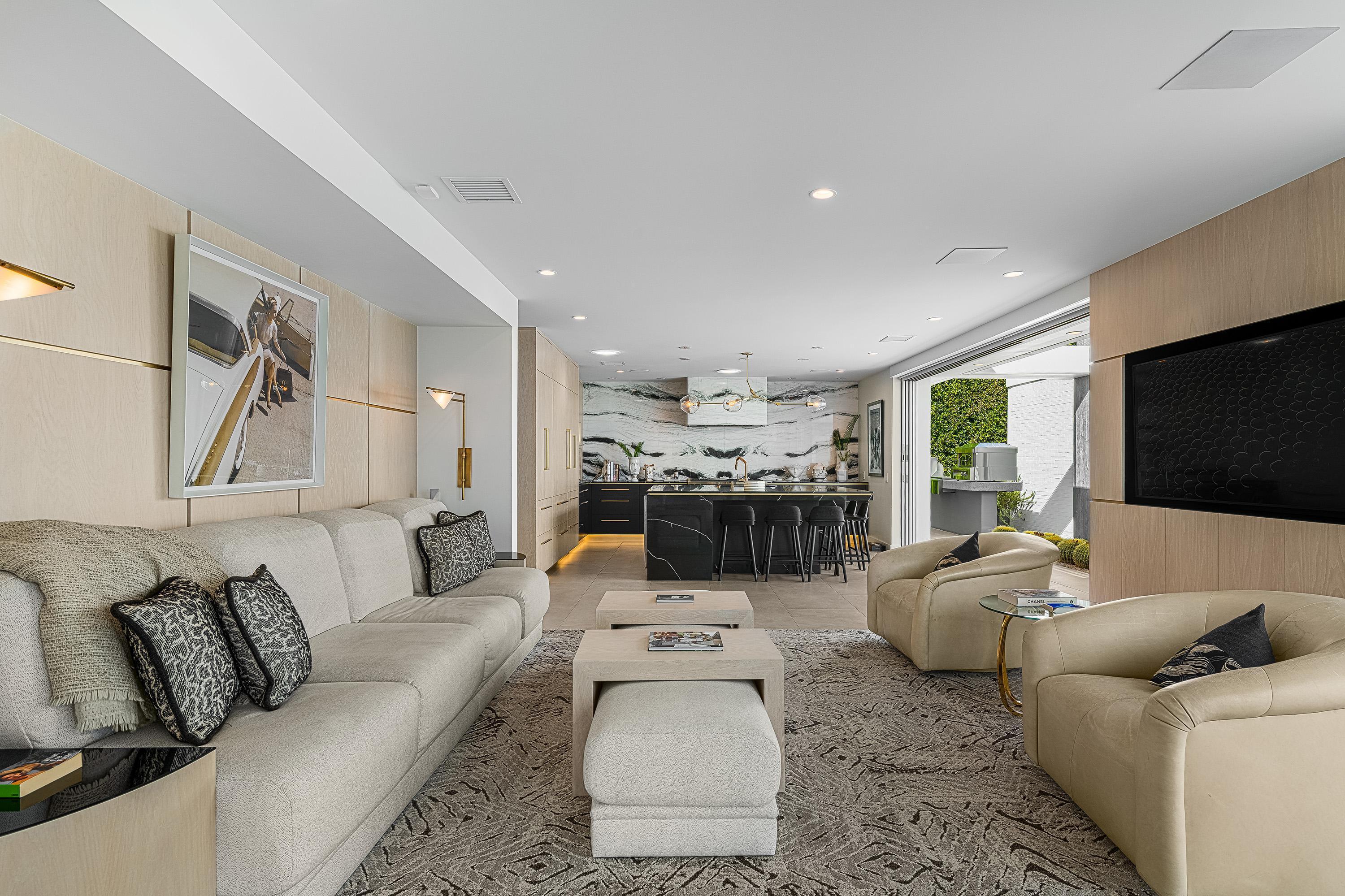 70260 Carson Road Rancho Mirage, CA 92270 - Photo 11 of 80 a living room with furniture and a flat screen tv