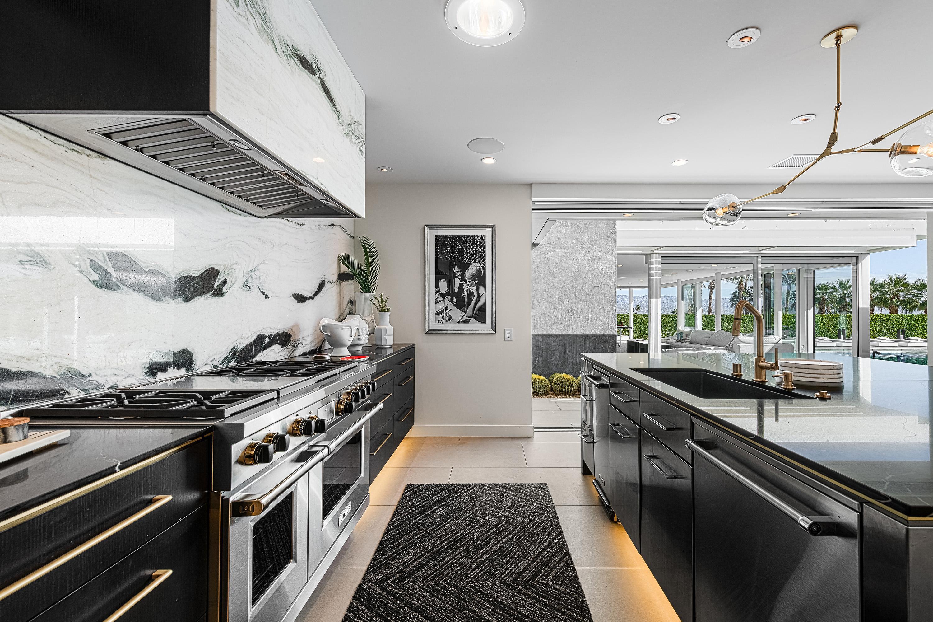 70260 Carson Road Rancho Mirage, CA 92270 - Photo 14 of 80 a kitchen with stainless steel appliances granite countertop a stove and a sink