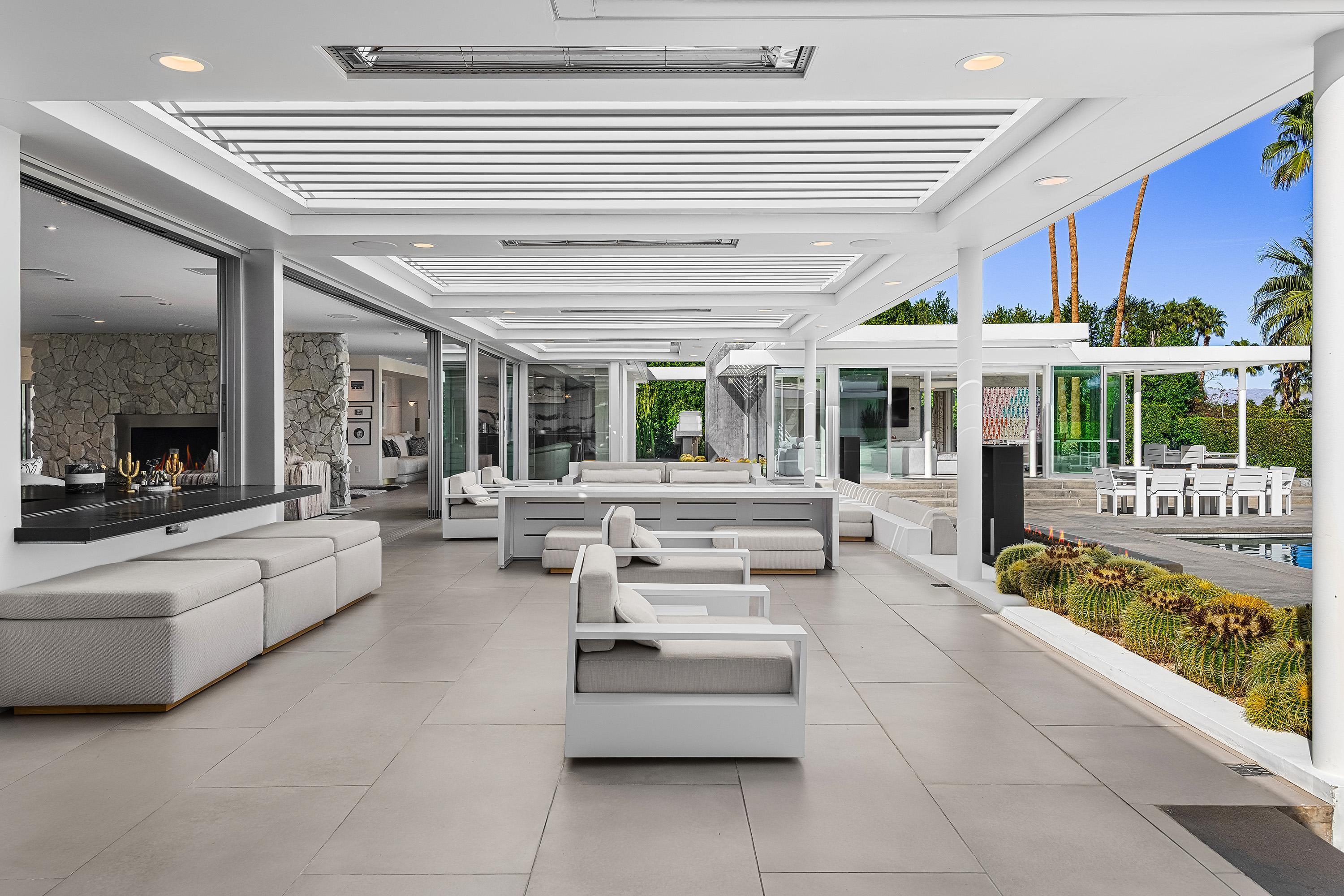 70260 Carson Road Rancho Mirage, CA 92270 - Photo 18 of 80 a living room with furniture and a large window