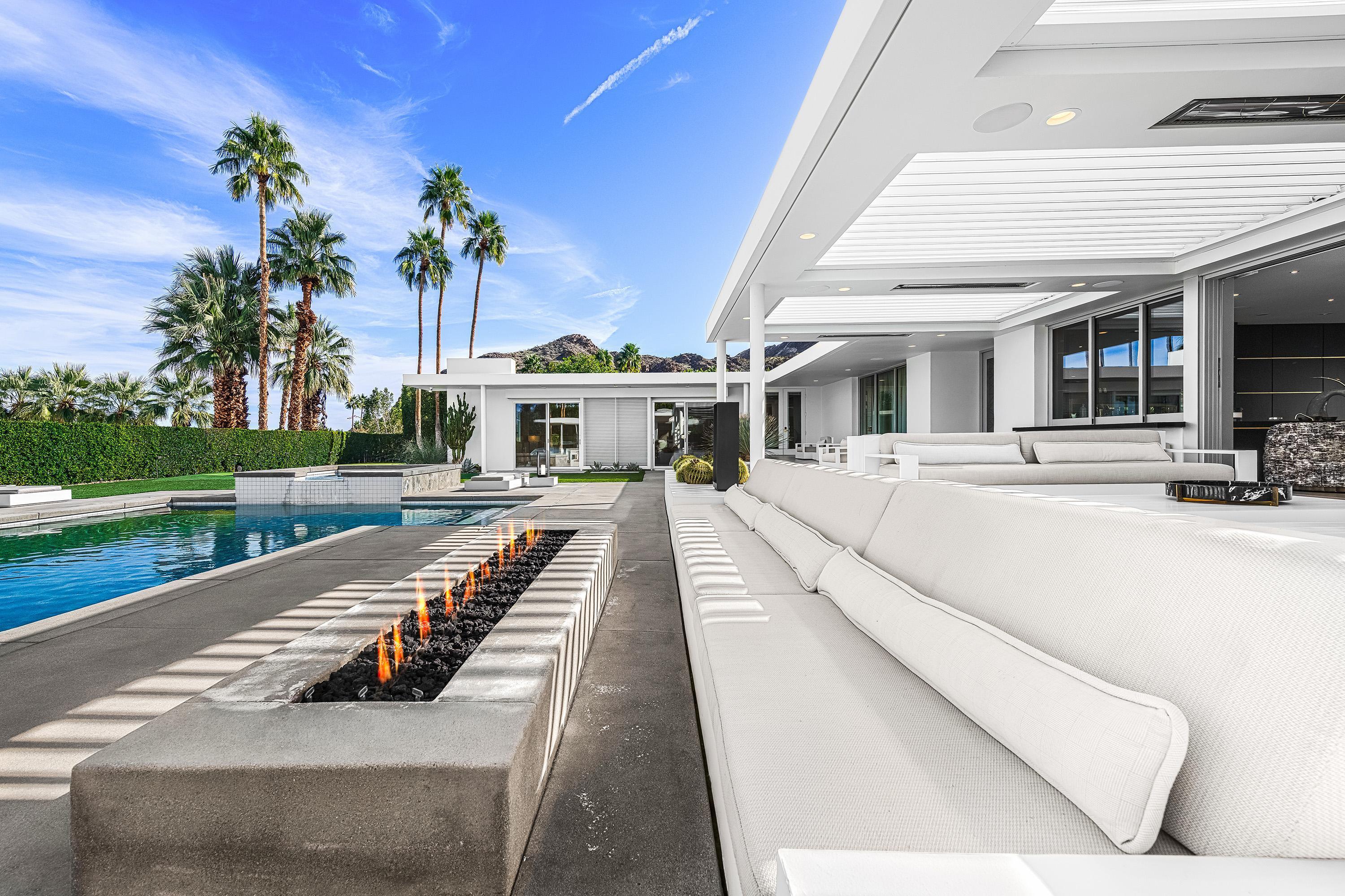70260 Carson Road Rancho Mirage, CA 92270 - Photo 20 of 80 a view of a house with cars park