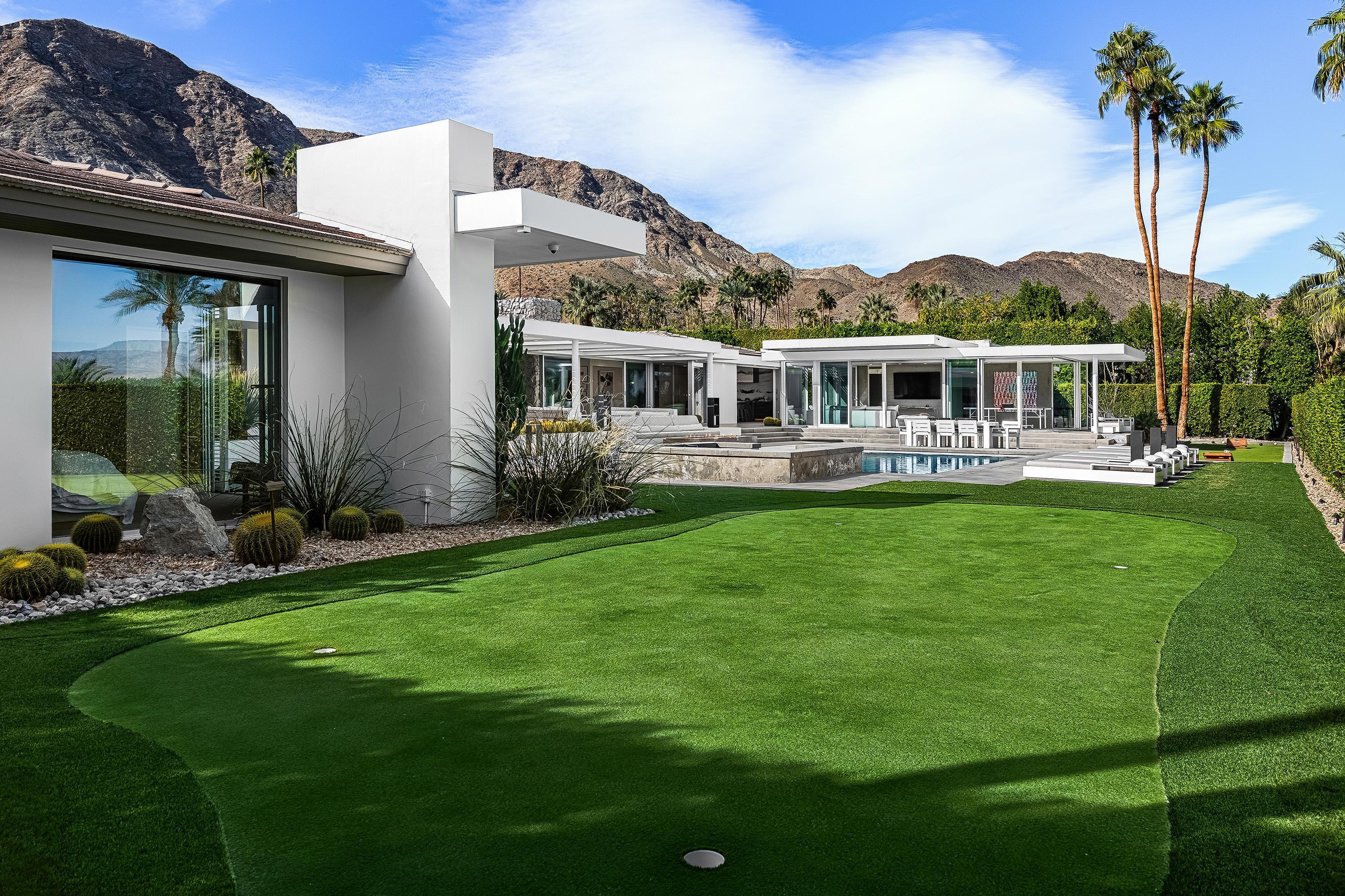 70260 Carson Road Rancho Mirage, CA 92270 - Photo 31 of 80 a front view of house with yard and outdoor seating