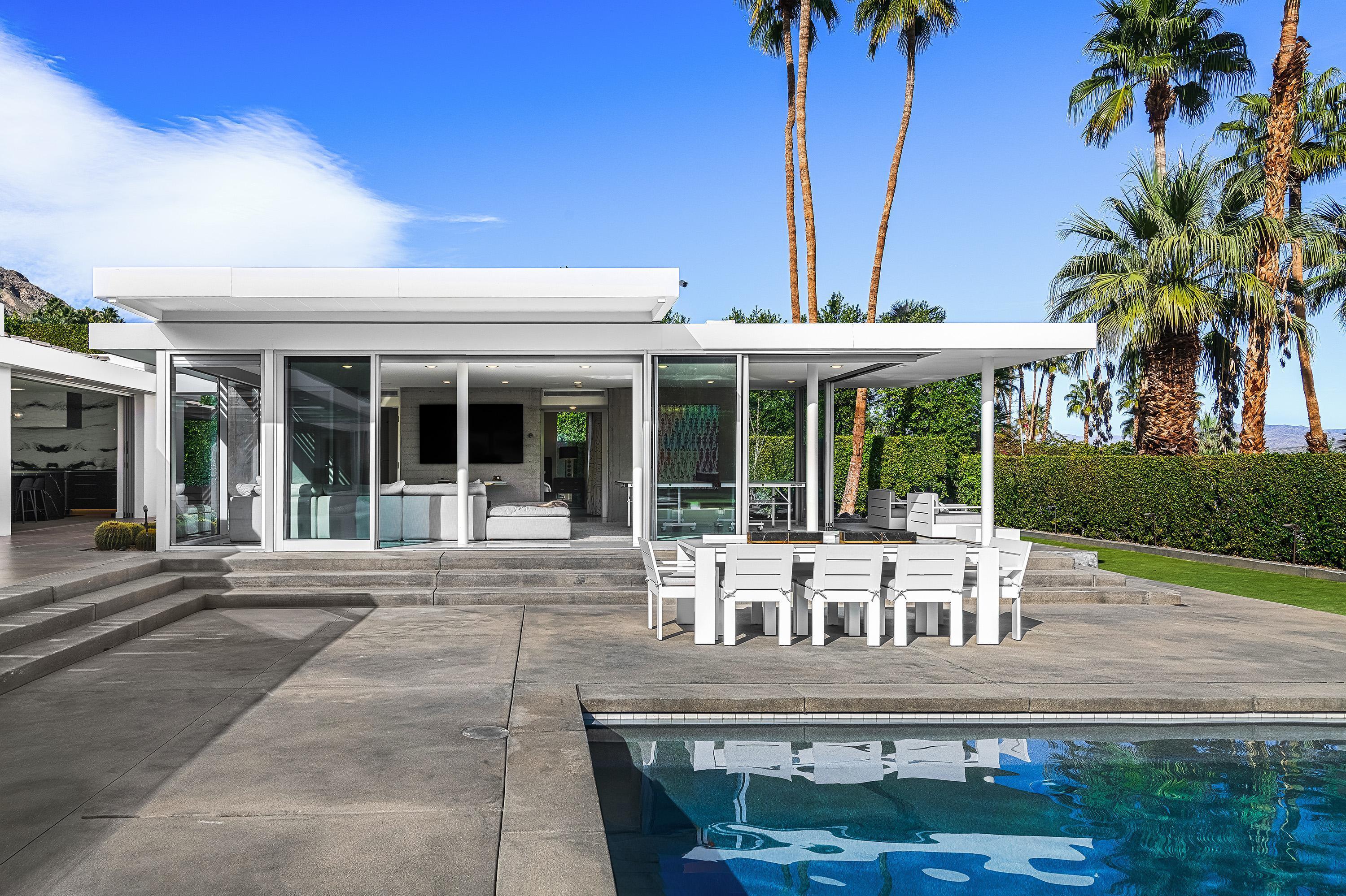 70260 Carson Road Rancho Mirage, CA 92270 - Photo 34 of 80 front view of house with a yard and potted plants