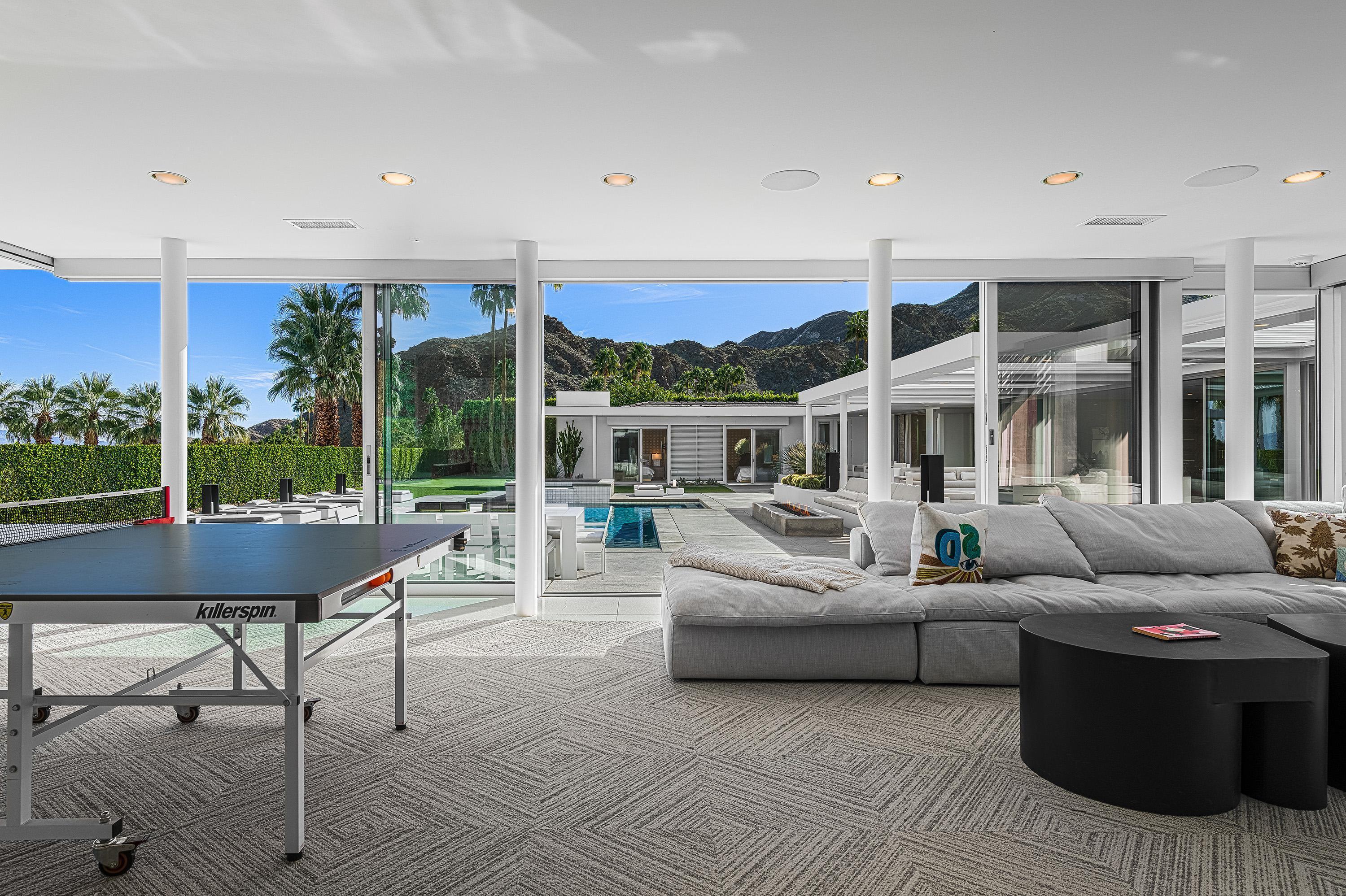 70260 Carson Road Rancho Mirage, CA 92270 - Photo 35 of 80 a living room with furniture and a large window