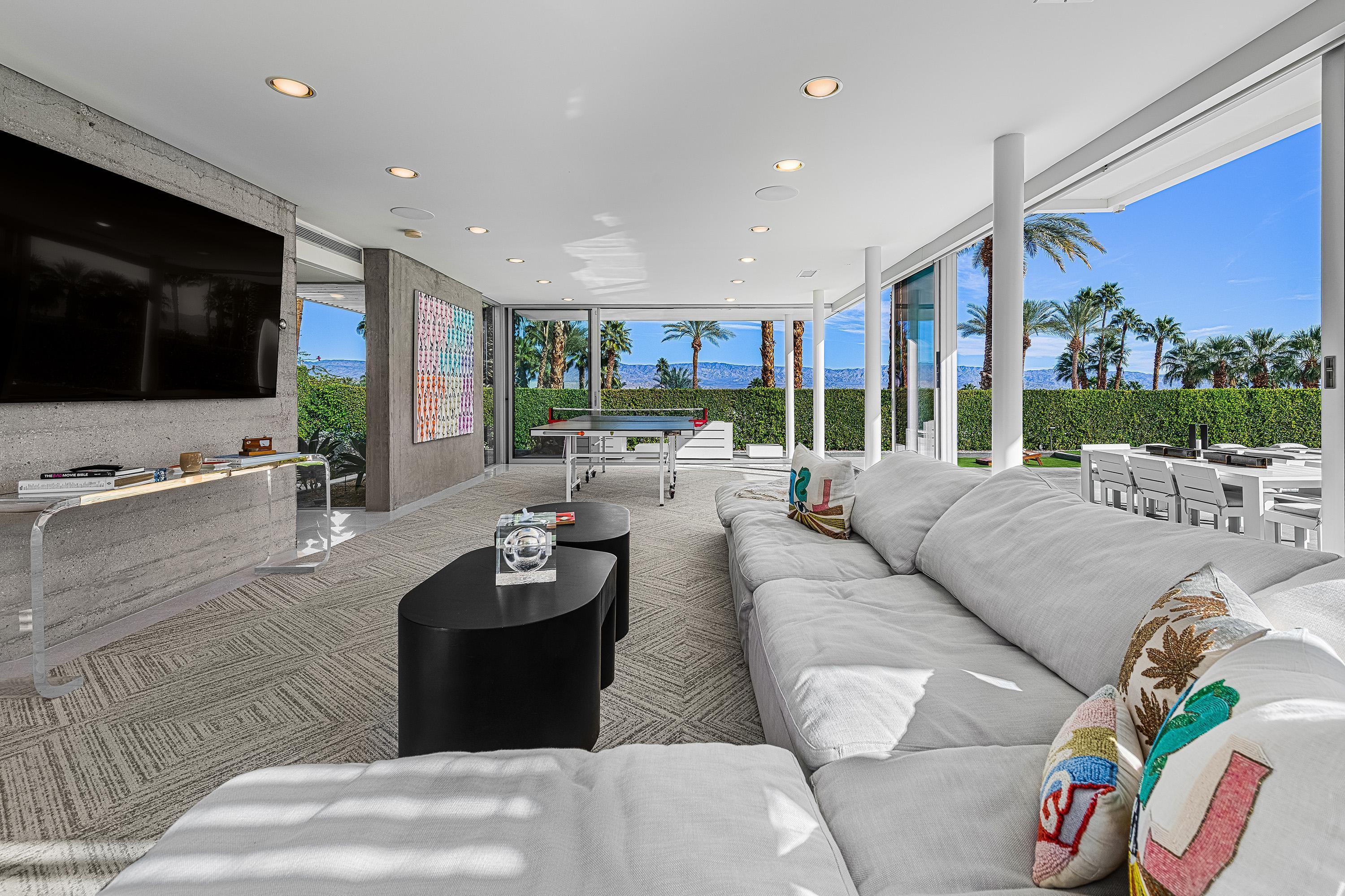 70260 Carson Road Rancho Mirage, CA 92270 - Photo 36 of 80 a living room with furniture and a flat screen tv