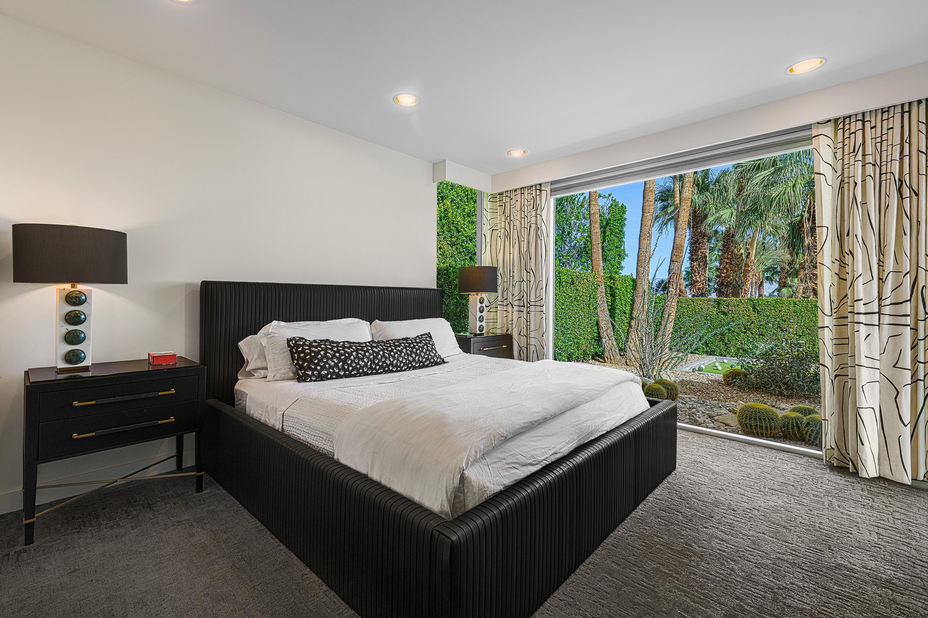 70260 Carson Road Rancho Mirage, CA 92270 - Photo 37 of 80 a bedroom with a large bed and a large window