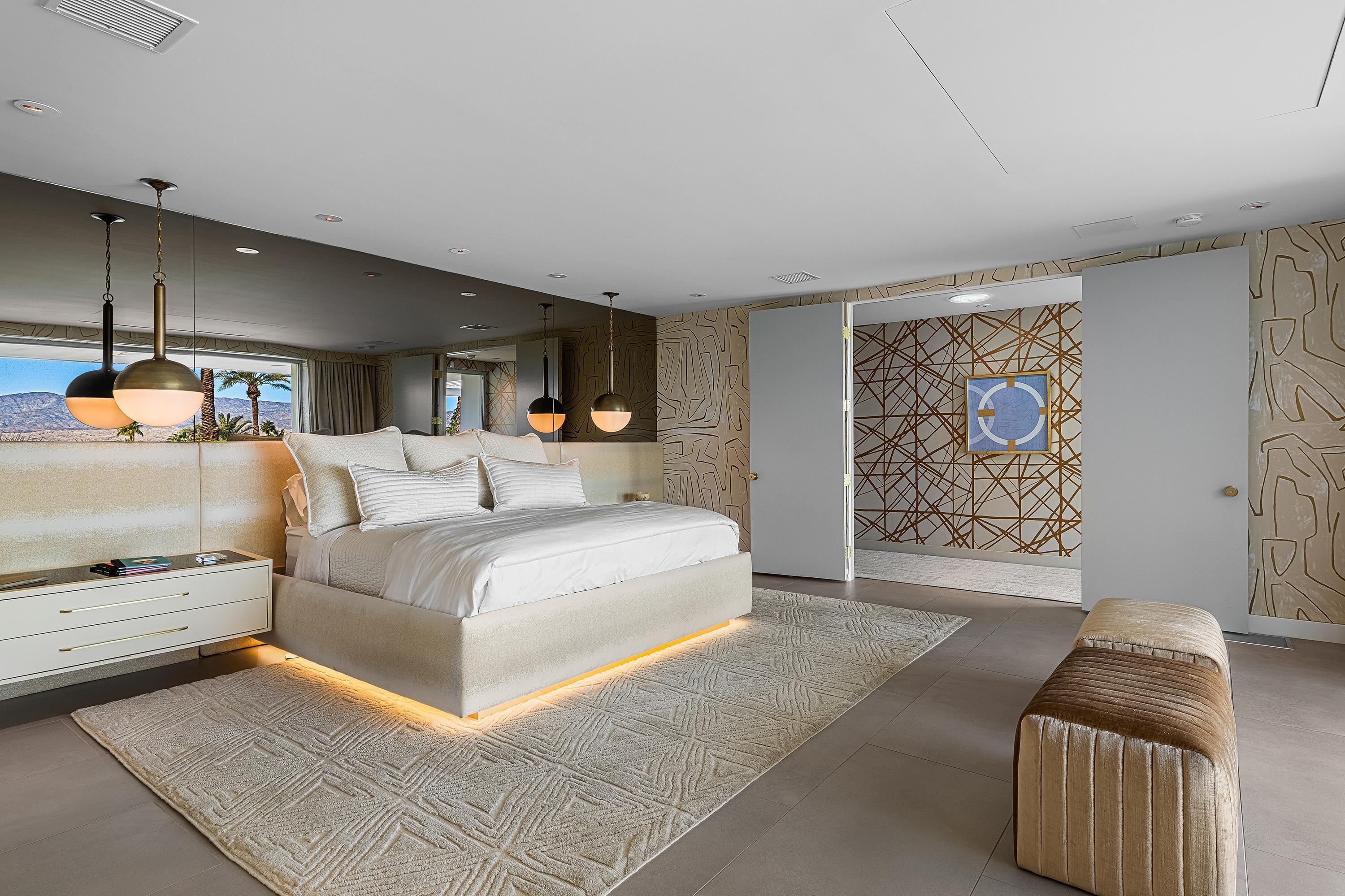 70260 Carson Road Rancho Mirage, CA 92270 - Photo 42 of 80 a spacious bedroom with a bed and a couch