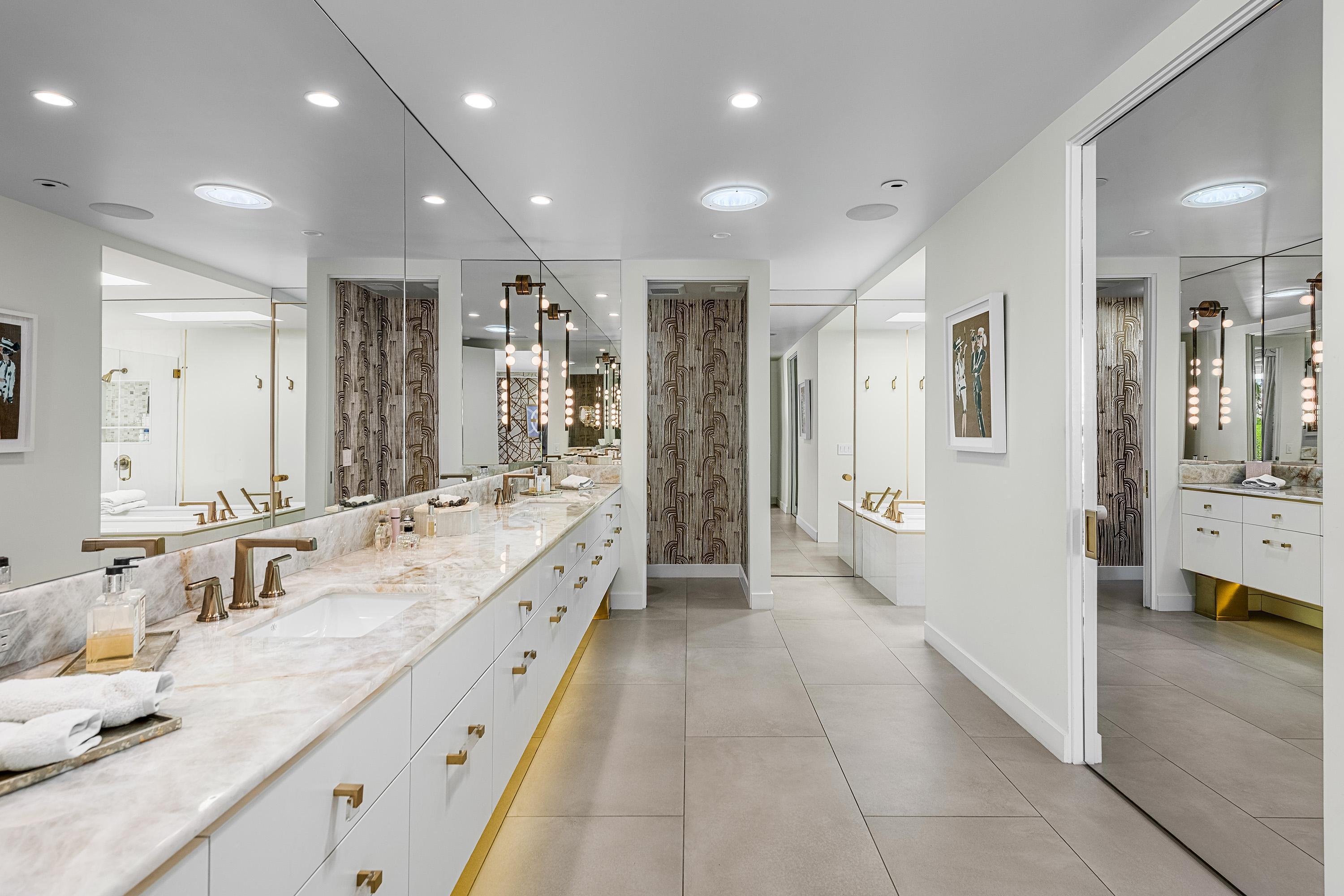 70260 Carson Road Rancho Mirage, CA 92270 - Photo 44 of 80 a large bathroom with a double vanity sink and a large mirror