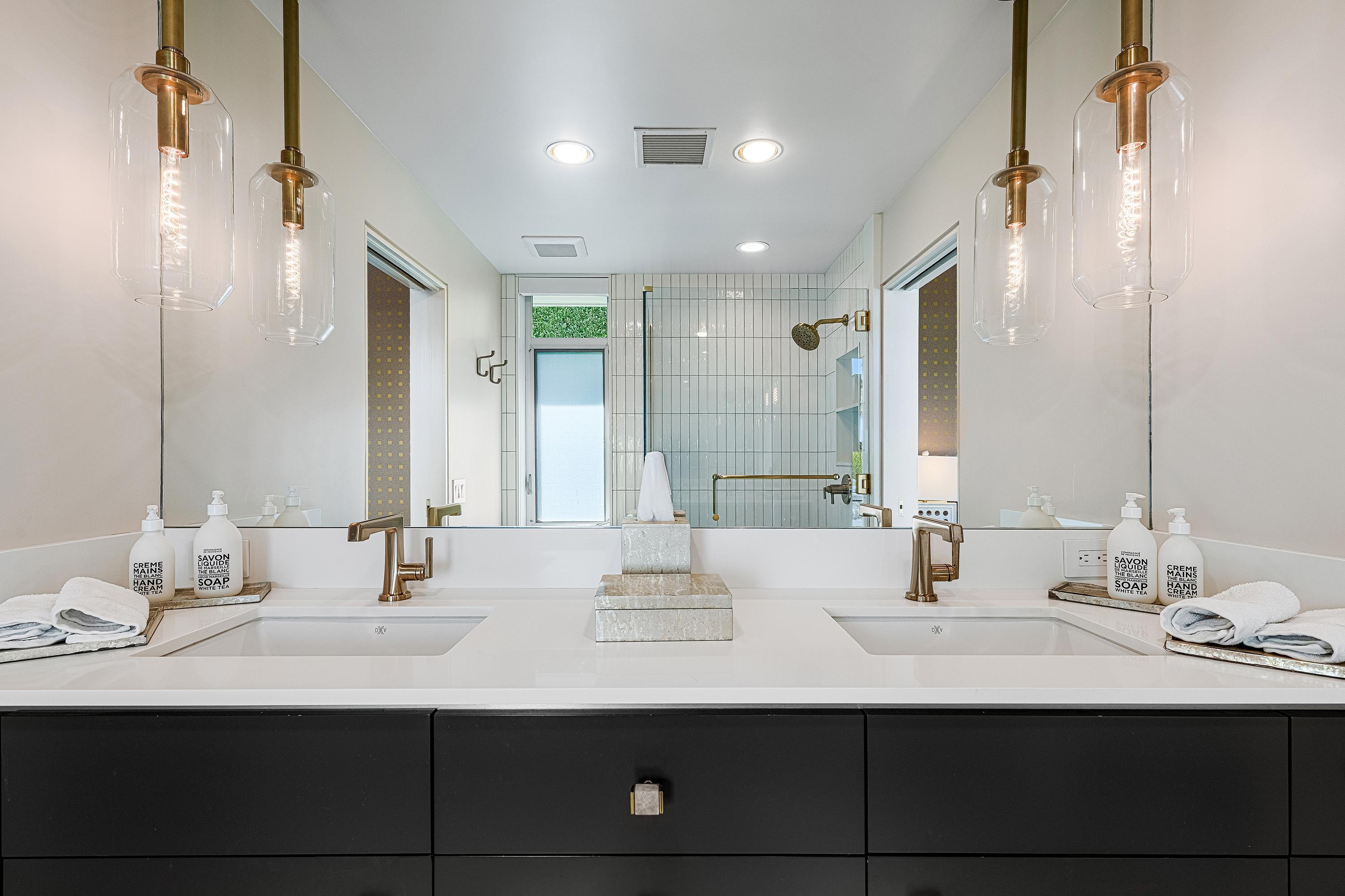 70260 Carson Road Rancho Mirage, CA 92270 - Photo 52 of 80 a bathroom with double sink and a mirror